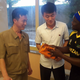 A Tanzanian student gives his North Korean hosts a gift.